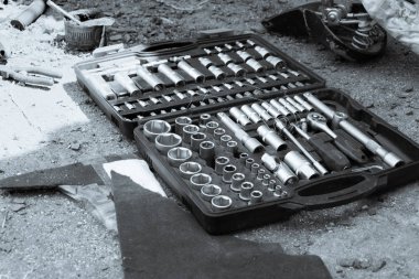 A set of socket keys in a box, a black and white photo. Concept of bike repair. clipart