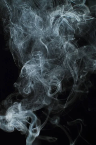 stock image White smoke texture on black background