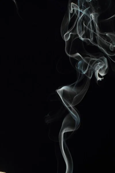 stock image White smoke texture on black background