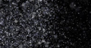 Siyah bir zemin üzerine kar yağışı