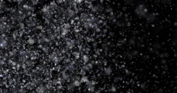 Siyah bir zemin üzerine kar yağışı