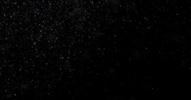 Siyah bir zemin üzerine kar yağışı