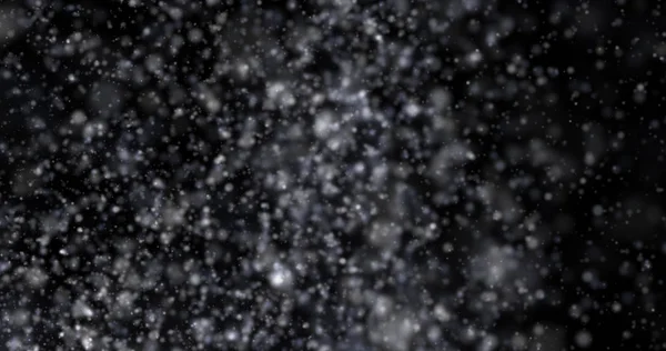 Siyah bir zemin üzerine kar yağışı