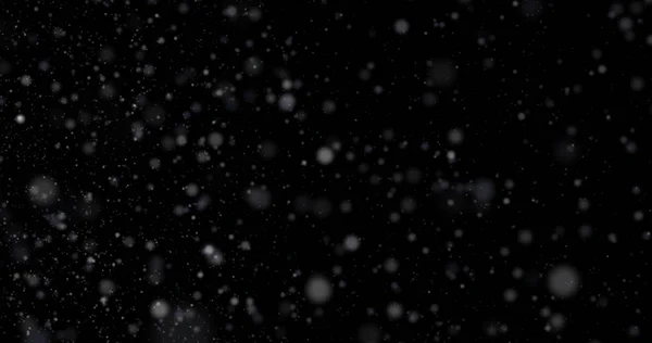 Siyah bir zemin üzerine kar yağışı