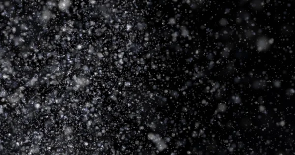 Siyah bir zemin üzerine kar yağışı