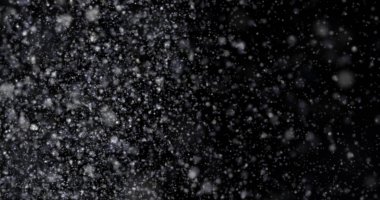 Siyah bir zemin üzerine kar yağışı