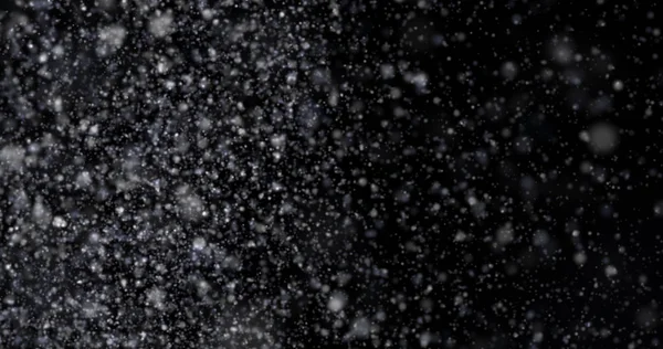 Siyah bir zemin üzerine kar yağışı