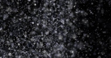 Siyah bir zemin üzerine kar yağışı