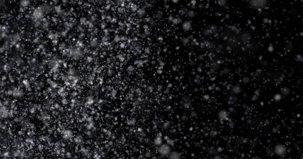 Siyah bir zemin üzerine kar yağışı