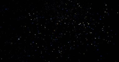 Siyah arkaplanda uçan toz parçacıkları