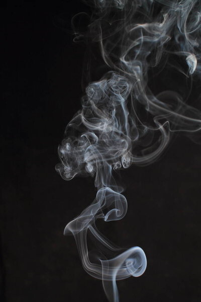 Abstract white smoke texture on black background
