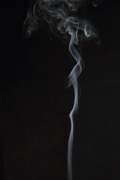 Abstract white smoke texture on black background