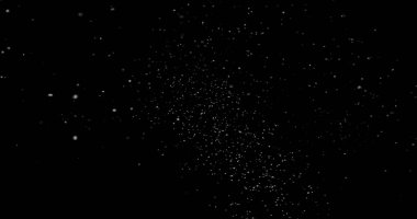 Siyah arkaplanda soyut toz parçacıkları uçuyor