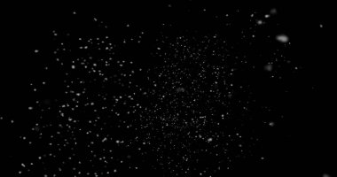 Siyah arkaplanda soyut toz parçacıkları uçuyor