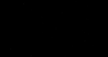 Siyah arkaplanda soyut toz parçacıkları uçuyor