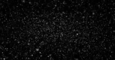 Siyah zemin üzerinde rastgele uçan küçük beyaz parçacıklara sahip video