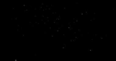 Siyah zemin üzerinde rastgele uçan küçük beyaz parçacıklara sahip video