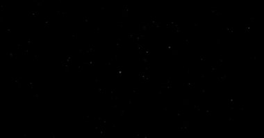 Siyah zemin üzerinde rastgele uçan küçük beyaz parçacıklara sahip video