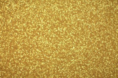 Parlak soyut parıltı dokusu dinamik tasarımı olan altın arkaplan