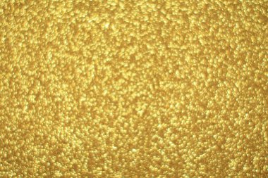Parlak soyut parıltı dokusu dinamik tasarımı olan altın arkaplan