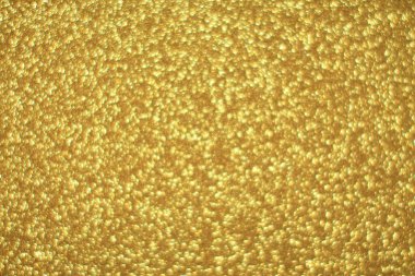Parlak soyut parıltı dokusu dinamik tasarımı olan altın arkaplan