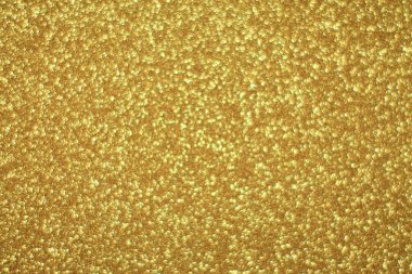 Parlak soyut parıltı dokusu dinamik tasarımı olan altın arkaplan