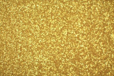 Parlak soyut parıltı dokusu dinamik tasarımı olan altın arkaplan