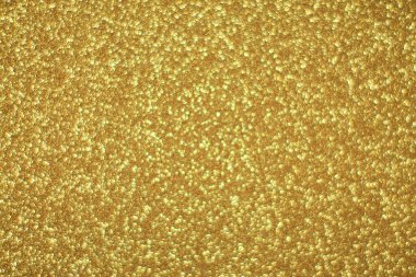 Parlak soyut parıltı dokusu dinamik tasarımı olan altın arkaplan