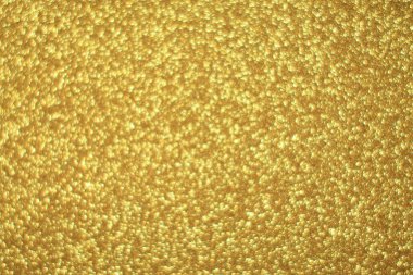 Parlak soyut parıltı dokusu dinamik tasarımı olan altın arkaplan