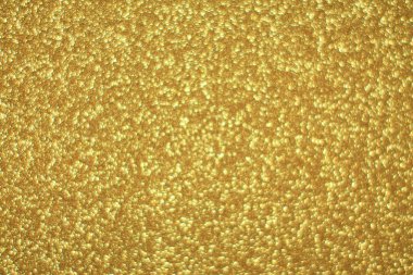 Parlak soyut parıltı dokusu dinamik tasarımı olan altın arkaplan