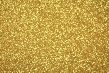 Parlak soyut parıltı dokusu dinamik tasarımı olan altın arkaplan
