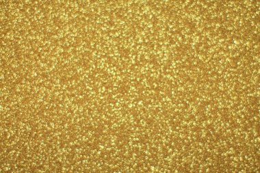 Parlak soyut parıltı dokusu dinamik tasarımı olan altın arkaplan