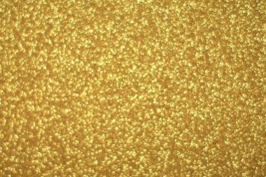 Parlak soyut parıltı dokusu dinamik tasarımı olan altın arkaplan