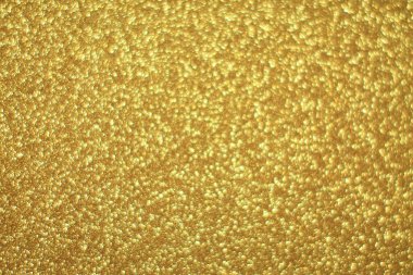 Parlak soyut parıltı dokusu dinamik tasarımı olan altın arkaplan