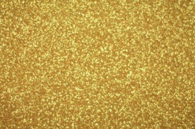 Parlak soyut parıltı dokusu dinamik tasarımı olan altın arkaplan