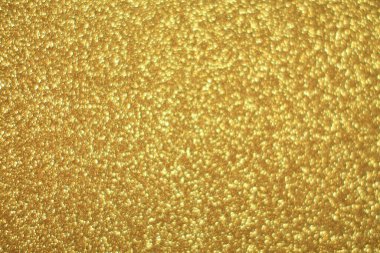 Parlak soyut parıltı dokusu dinamik tasarımı olan altın arkaplan