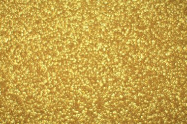 Parlak soyut parıltı dokusu dinamik tasarımı olan altın arkaplan