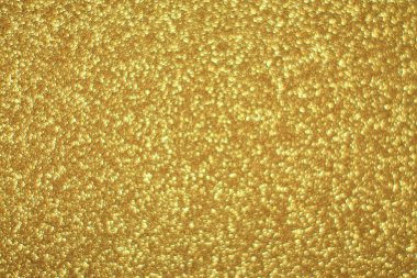 Parlak soyut parıltı dokusu dinamik tasarımı olan altın arkaplan