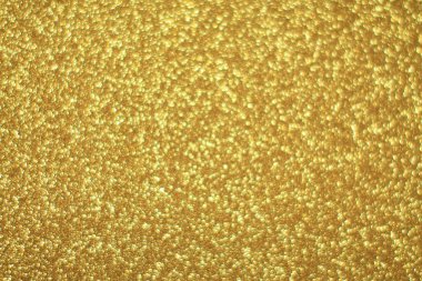 Parlak soyut parıltı dokusu dinamik tasarımı olan altın arkaplan