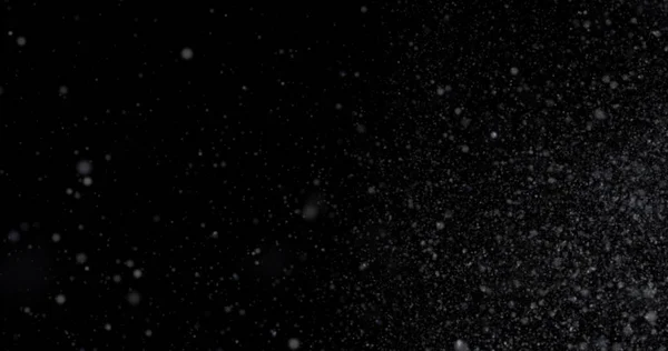 抽象的なテクスチャ ほこりのフレーク 暗い背景に降る雪 — ストック写真
