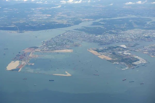 Business International trade and Container logistics export-import harbor to the International port / Shipping Containers - Bird\'s-eye view from airplane