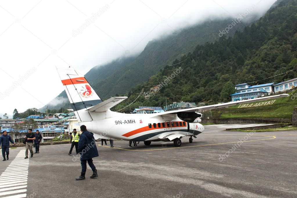 Passengers get off from Summit Air at Lukla airport ,Lukla airport is one of the most dangerous airport in the world.