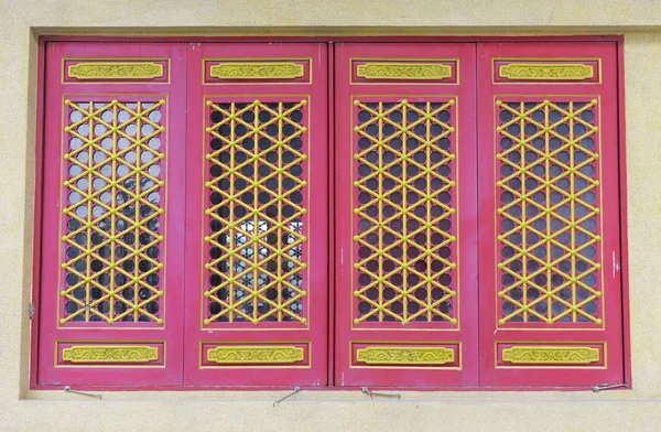 Red and gold wooden window in chinese window