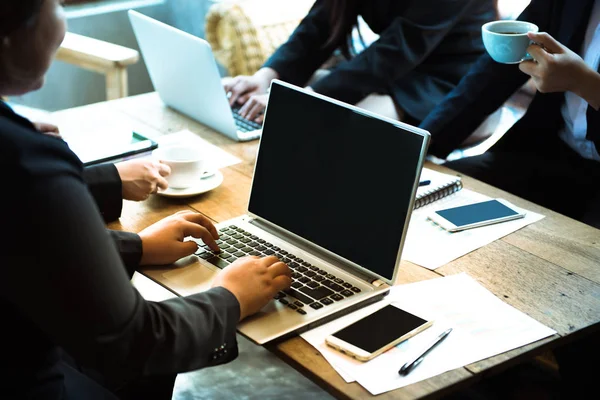 Group of business co worker work together in office with sipping coffee and using laptop and smart mobile phone,teamwork concept