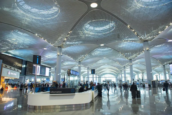 Interior of new Turkish Istanbul airport with passengers and officer. — Stock Photo, Image