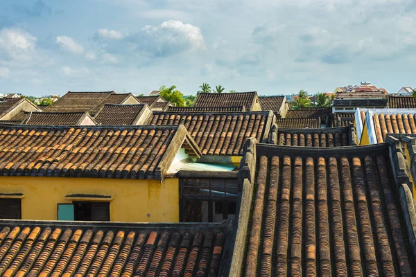 Old yellow roof top tile of local home in Hoi an Vietnam.