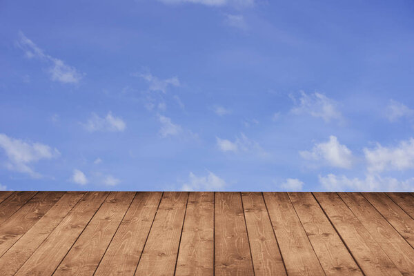 Wood perspective with blue sky in background for advertise