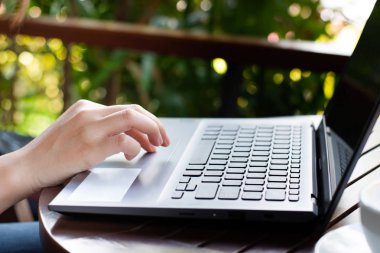 Women using laptop computer at cafe