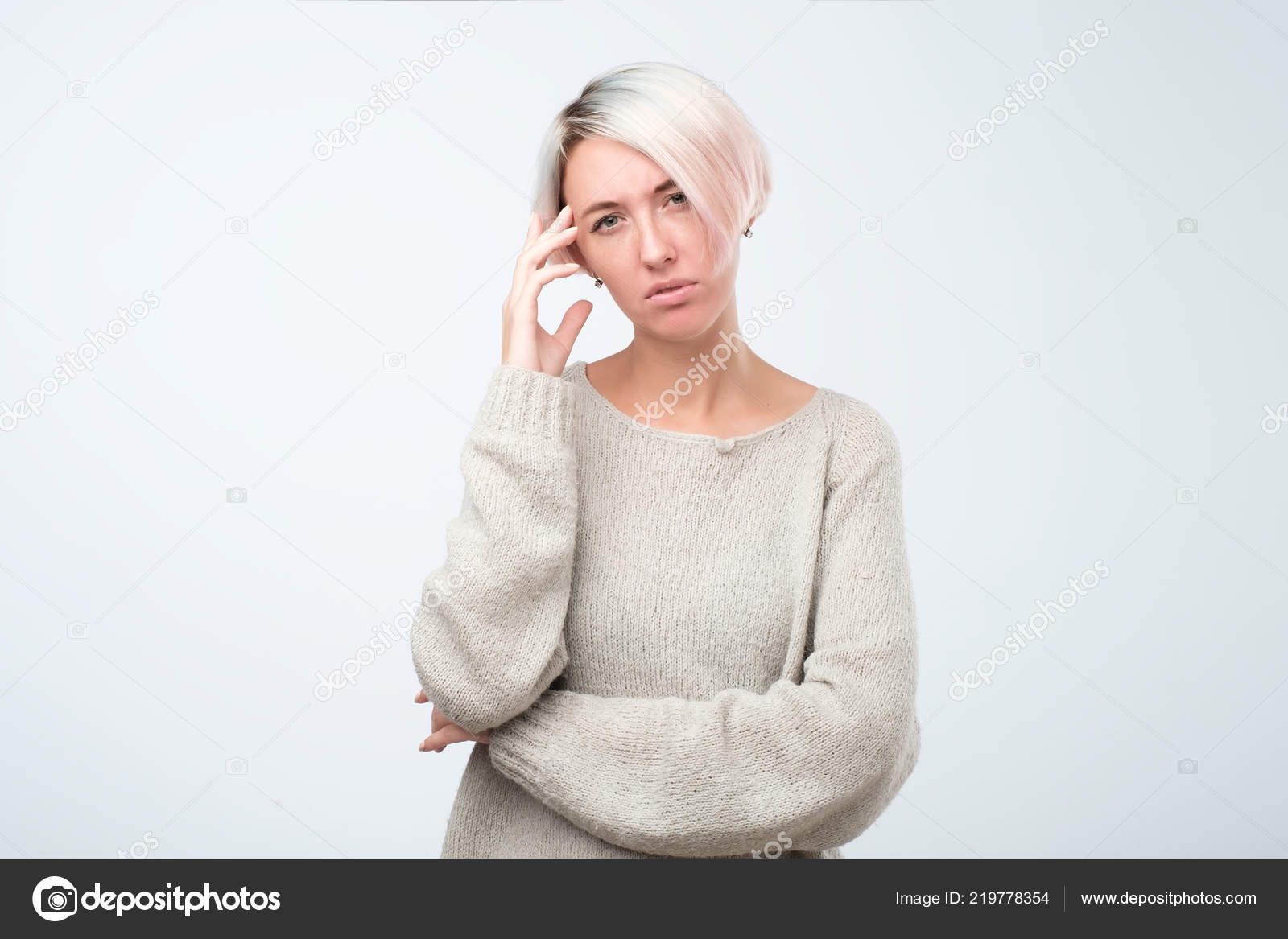Thoughtful Model With Short Dyed Hair Dressed In Gray