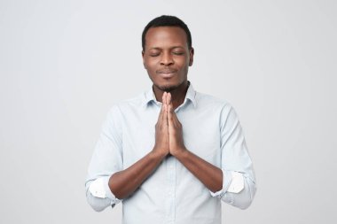African young guy asking for a favor. Please cover me at work. clipart